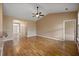 Open-concept living area featuring wood floors, neutral paint, and views of other rooms at 183 Cypress Forest Dr, Moncks Corner, SC 29461