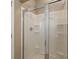 White shower stall with sliding glass doors and corner shelving at 183 Cypress Forest Dr, Moncks Corner, SC 29461