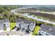 Aerial view showcasing townhomes near marsh and river at 185 Winding River Dr, Johns Island, SC 29455