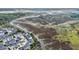 An aerial view showcasing waterfront homes nestled by the marsh and river at 185 Winding River Dr, Johns Island, SC 29455