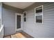 Charming balcony featuring durable wood flooring and neutral toned siding at 185 Winding River Dr, Johns Island, SC 29455