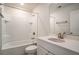 Clean bathroom with a white tiled shower-tub combo, vanity sink, and a large mirror at 185 Winding River Dr, Johns Island, SC 29455