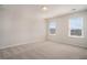 This large bedroom features neutral carpet, two large windows, and is ready for your personal touch at 185 Winding River Dr, Johns Island, SC 29455
