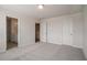 Spacious bedroom with neutral carpet, walk-in closet, and adjoining bathroom ready for your personal touches at 185 Winding River Dr, Johns Island, SC 29455