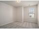 Bright bedroom with neutral walls, soft carpet, and a window that provides natural light at 185 Winding River Dr, Johns Island, SC 29455