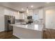 Modern kitchen with stainless steel appliances, white cabinets, and stone countertops at 185 Winding River Dr, Johns Island, SC 29455
