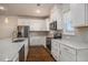 Bright kitchen features white cabinetry, stainless appliances, stone countertops, and wood look floors at 185 Winding River Dr, Johns Island, SC 29455