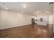 Spacious living room with wood flooring flowing into the modern kitchen at 185 Winding River Dr, Johns Island, SC 29455