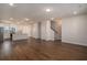 Bright open-concept living space featuring wood floors flowing to kitchen at 185 Winding River Dr, Johns Island, SC 29455