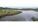 Scenic view of the marsh featuring river, grasses, and trees at 185 Winding River Dr, Johns Island, SC 29455