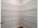 This walk in pantry features extensive white wire shelving, offering ample storage space at 185 Winding River Dr, Johns Island, SC 29455