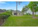 The backyard features a wrought iron fence and covered patio, perfect for outdoor entertaining at 207 Brutus Ln, Summerville, SC 29485