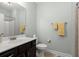 Bathroom featuring a vanity with dark wood cabinets and a white countertop, complemented by neutral wall paint at 207 Brutus Ln, Summerville, SC 29485