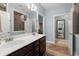Well-lit bathroom features double vanity, framed mirrors, and neutral color palette at 207 Brutus Ln, Summerville, SC 29485