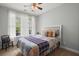Bright bedroom with a white headboard, cozy quilt, and natural light at 207 Brutus Ln, Summerville, SC 29485