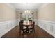 Formal dining area showcasing hardwood floors, decorative molding, and chandelier lighting at 207 Brutus Ln, Summerville, SC 29485
