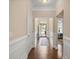 Welcoming entryway with hardwood floors, detailed wainscoting, and a view to the front door at 207 Brutus Ln, Summerville, SC 29485