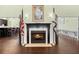 A cozy fireplace with flags and a bar seating area with a painting on the wall at 207 Brutus Ln, Summerville, SC 29485