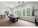 Game room featuring a pool table, seating area, bright windows and neutral carpet at 207 Brutus Ln, Summerville, SC 29485