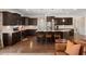 Open kitchen with granite countertops, center island with seating, and stainless steel appliances at 207 Brutus Ln, Summerville, SC 29485