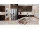 Bright kitchen with stainless steel appliances, granite counters, and access to the laundry area at 207 Brutus Ln, Summerville, SC 29485