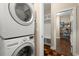 Convenient laundry room with stacked washer and dryer, plus built-in storage at 207 Brutus Ln, Summerville, SC 29485