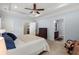 Spacious bedroom featuring tray ceiling, fan, carpet, and ensuite bathroom at 207 Brutus Ln, Summerville, SC 29485