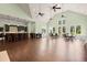 A large, well-lit meeting room featuring tables, chairs, and an adjacent kitchen area at 207 Brutus Ln, Summerville, SC 29485