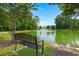 Scenic view of a pond with a fountain, captured from a sitting area with bench at 207 Brutus Ln, Summerville, SC 29485