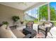 Screened porch featuring wicker furniture and view of backyard at 207 Brutus Ln, Summerville, SC 29485