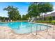 Community pool featuring a zero entry access, lounge chairs, and lush landscaping at 207 Brutus Ln, Summerville, SC 29485
