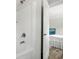 Bright white bathroom with shower/tub combination, white tiles, and view into bedroom at 208 General Moultrie Dr, Bonneau, SC 29431