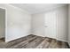 Empty bedroom showcasing neutral walls and wood floor at 208 General Moultrie Dr, Bonneau, SC 29431