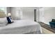 Bright bedroom features ample natural light and a view into the en-suite bathroom at 208 General Moultrie Dr, Bonneau, SC 29431