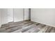 Empty bedroom showcasing doors, neutral walls and modern wood floors at 208 General Moultrie Dr, Bonneau, SC 29431