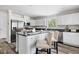 Updated kitchen featuring white cabinets, a center island, and stainless steel appliances at 208 General Moultrie Dr, Bonneau, SC 29431