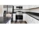 Modern kitchen features stainless steel appliances, white cabinetry, and sleek countertops at 208 General Moultrie Dr, Bonneau, SC 29431