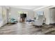 Bright living room featuring neutral tones, stylish decor, and wood flooring at 208 General Moultrie Dr, Bonneau, SC 29431