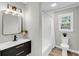 Updated bathroom with modern lighting and a shower/tub combo at 209 Pineview Dr, Goose Creek, SC 29445