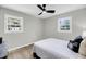 Bedroom has two windows, a ceiling fan, and wood floors with lots of natural light at 209 Pineview Dr, Goose Creek, SC 29445