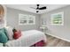 Bedroom with wood floors and two windows, plus a ceiling fan to help keep things cool at 209 Pineview Dr, Goose Creek, SC 29445