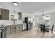 Spacious eat-in kitchen features stainless steel appliances, gray cabinets, and light wood floors at 209 Pineview Dr, Goose Creek, SC 29445