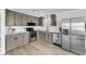 Modern kitchen features stainless steel appliances, ample counter space, and sleek gray cabinetry at 209 Pineview Dr, Goose Creek, SC 29445