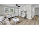 Inviting living room showcasing modern décor, neutral tones, and an abundance of natural light at 209 Pineview Dr, Goose Creek, SC 29445