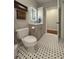 Modern bathroom features a vanity with black and white patterned tile flooring at 21 George St # 102, Charleston, SC 29401