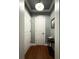 Inviting entryway with a hall table, artwork, and hardwood floors at 21 George St # 102, Charleston, SC 29401