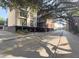 Charming multi-story building along a tree-lined street, blending with the historic neighborhood at 21 George St # 102, Charleston, SC 29401