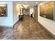 Well-lit hallway with artwork, providing a welcoming entrance to the residential units at 21 George St # 102, Charleston, SC 29401