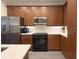 Well-equipped kitchen with stainless steel refrigerator, black appliances, and generous counter space at 21 George St # 102, Charleston, SC 29401
