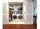 Functional laundry room with a side-by-side washer and dryer at 21 George St # 102, Charleston, SC 29401